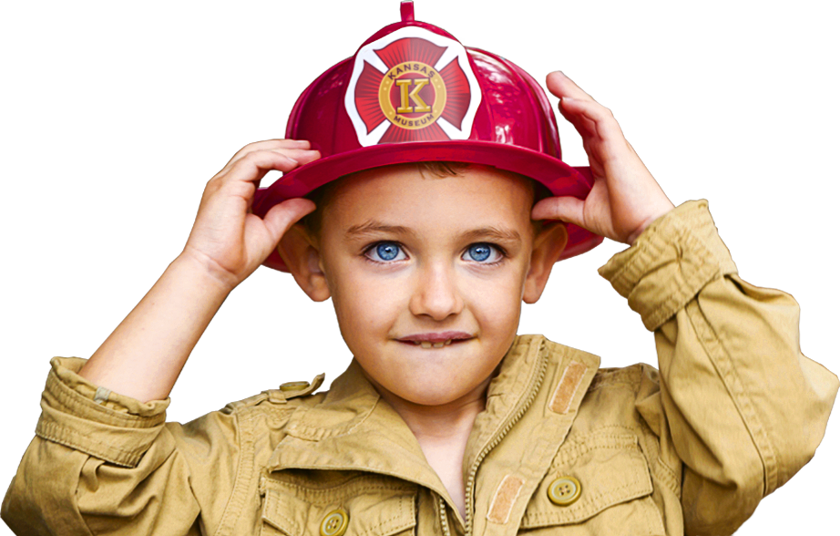 young boy wearing fire helmet hat
